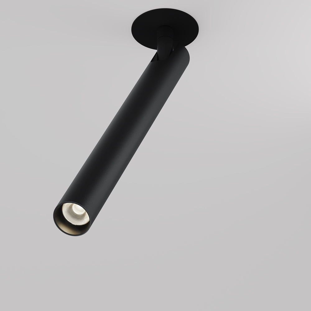 Spot cylindrique noir incliné monté au plafond sur embase ronde, vu de trois quarts