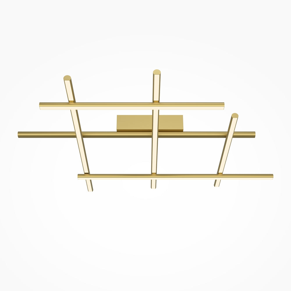 Luminaire doré vu de face, tubes croisés formant une grille géométrique