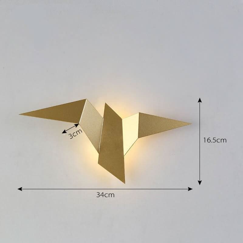 Schéma coté de l'applique dorée : 34 cm de large, 16,5 cm de haut, 3 cm d'épaisseur