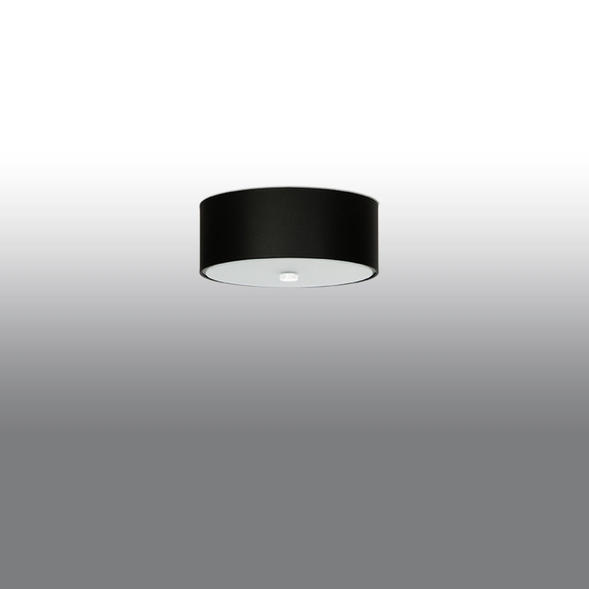 Produit de profil sur fond gris dégradé, cylindre noir fixé sous plafond