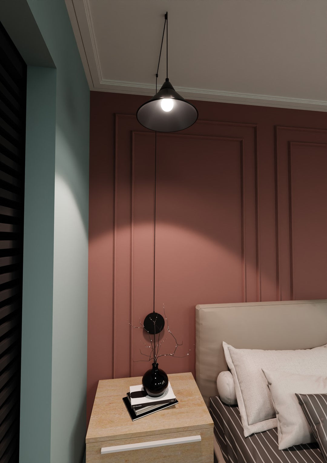 Ambiance de nuit, suspension noire suspendue devant un mur rose, lit et coussins visibles.