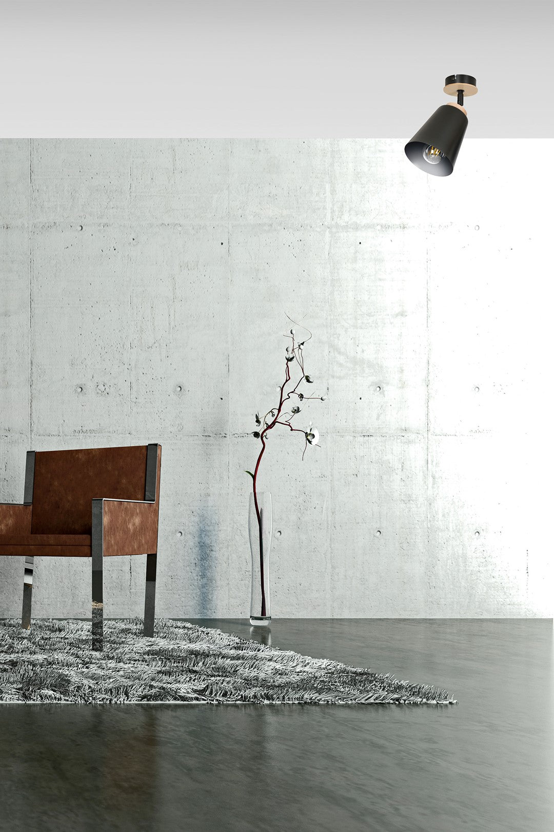 Mise en ambiance sur mur béton avec fauteuil, vase et grande plante séchée