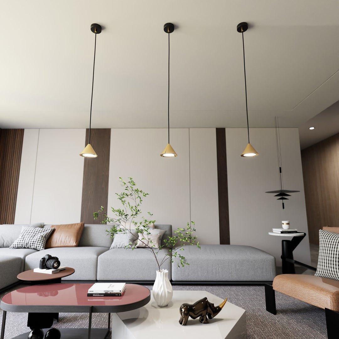 Vue d'ensemble du séjour avec trois pièces suspendues et décoration