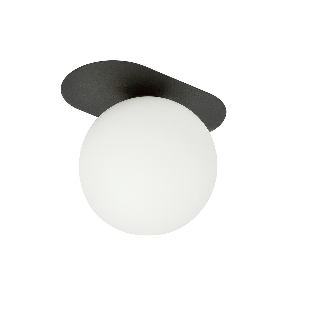 Vue en plongée révélant la platine ovale noire et la sphère décentrée