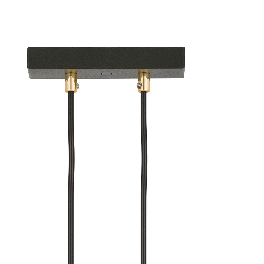 Détail de la platine de fixation noire et des embouts dorés avec cordons noirs.