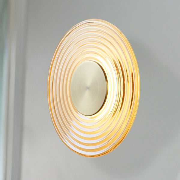 Applique murale LED Cleo en verre, ambre et laiton, Ø 30 cm