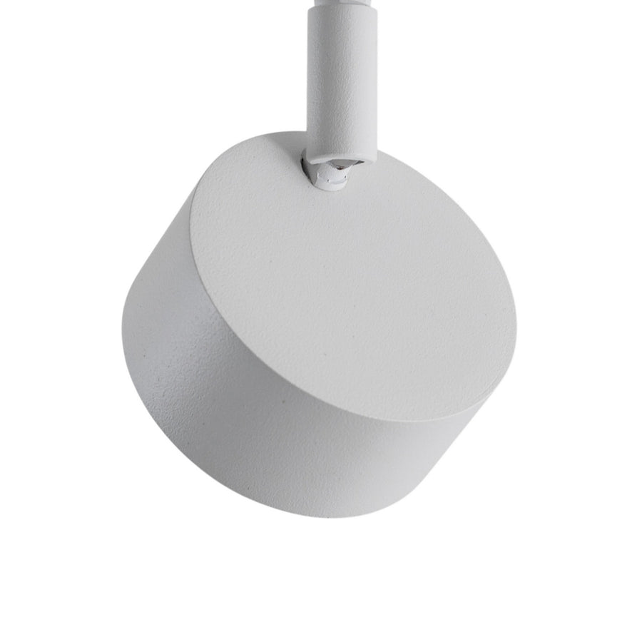 Détail d'une tête cylindrique blanche, articulation et finition texturée en gros plan.