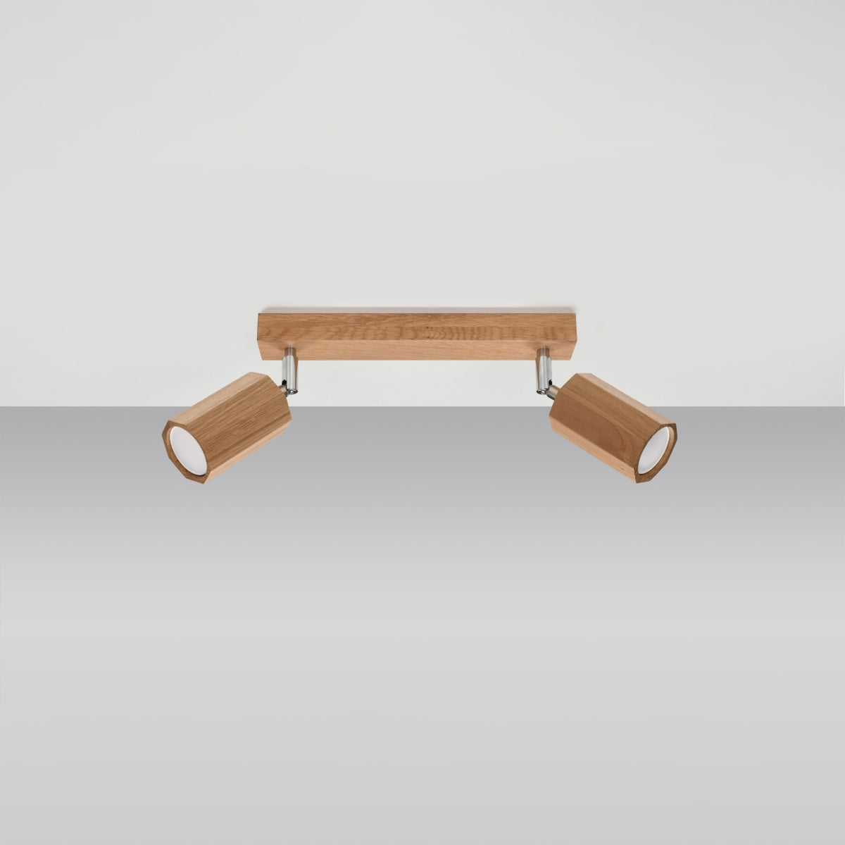 Produit présenté seul sur fond clair, base rectangulaire et deux projecteurs en bois.
