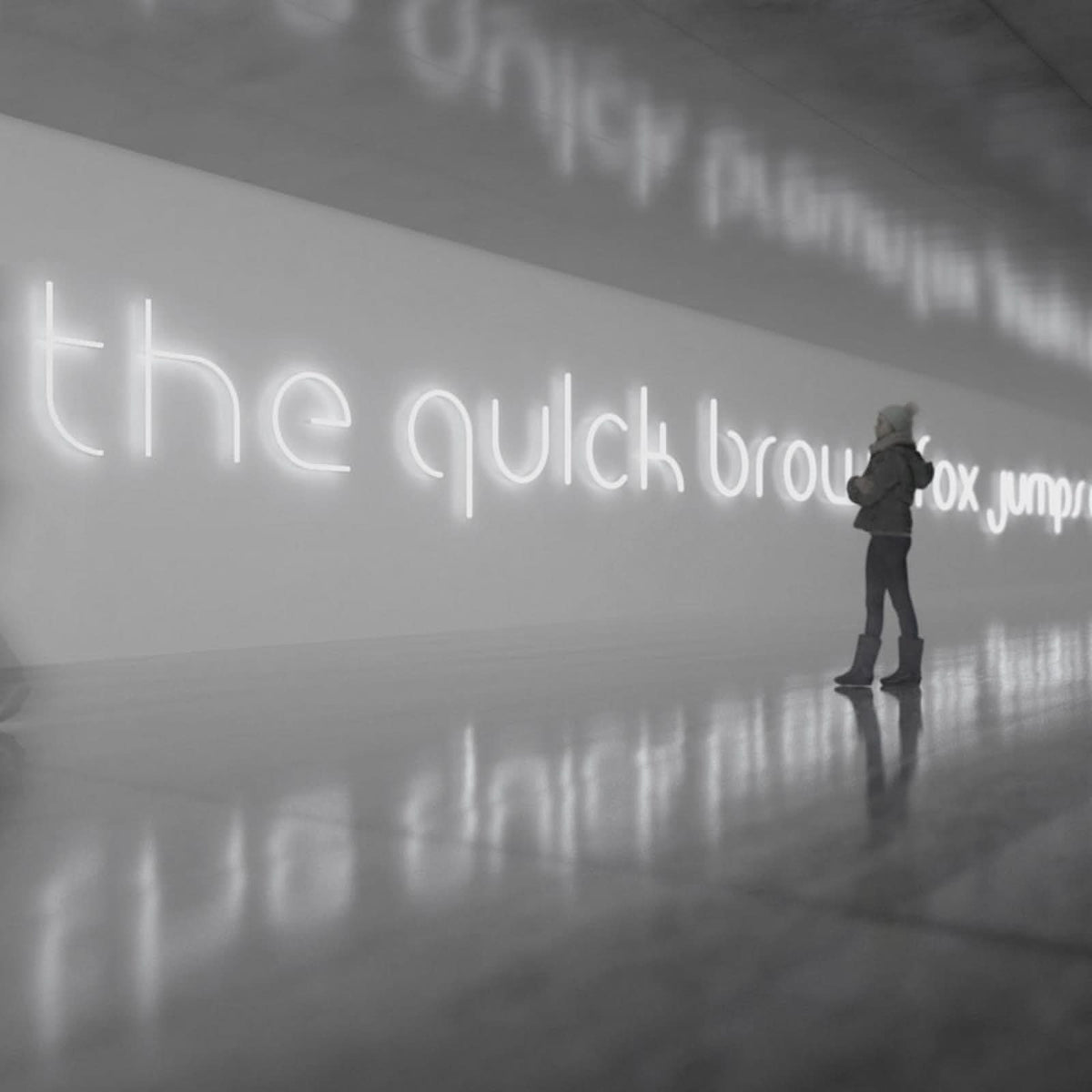 Personne debout devant une phrase lumineuse en néon blanc dans un espace réfléchissant.