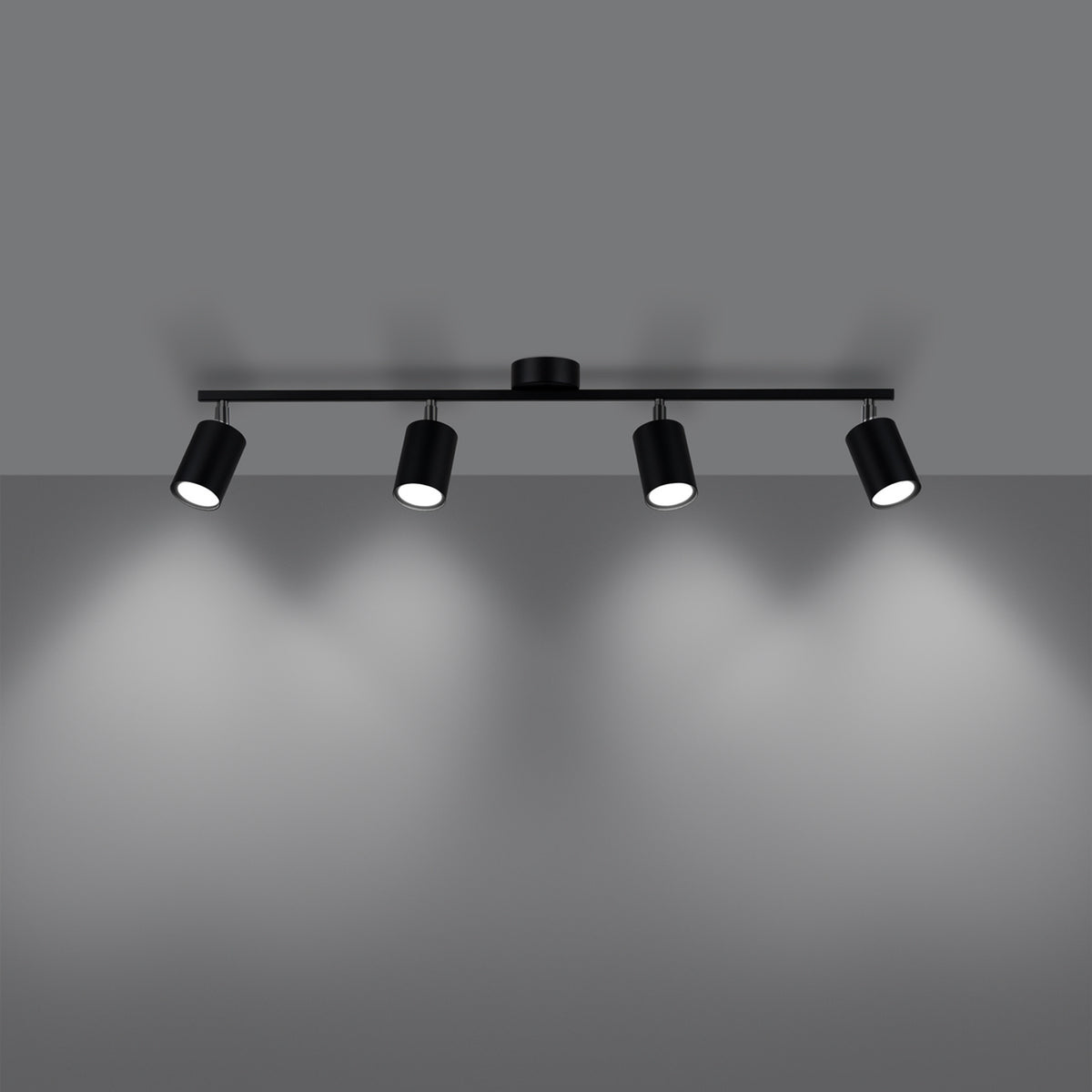 Mise en ambiance sombre avec quatre faisceaux lumineux projetés sur le mur