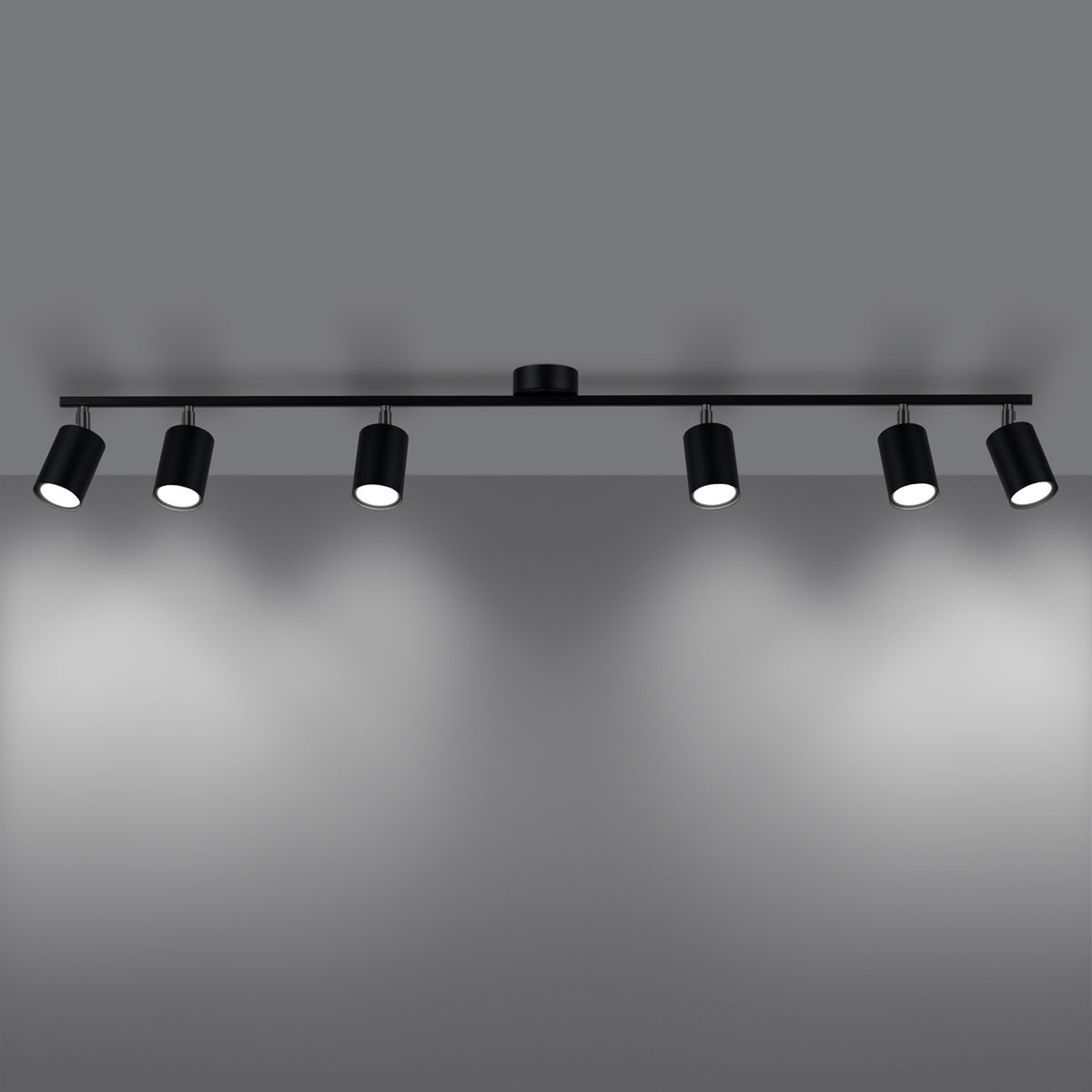 Rendu allumé du plafonnier, six faisceaux lumineux projetés sur un mur gris