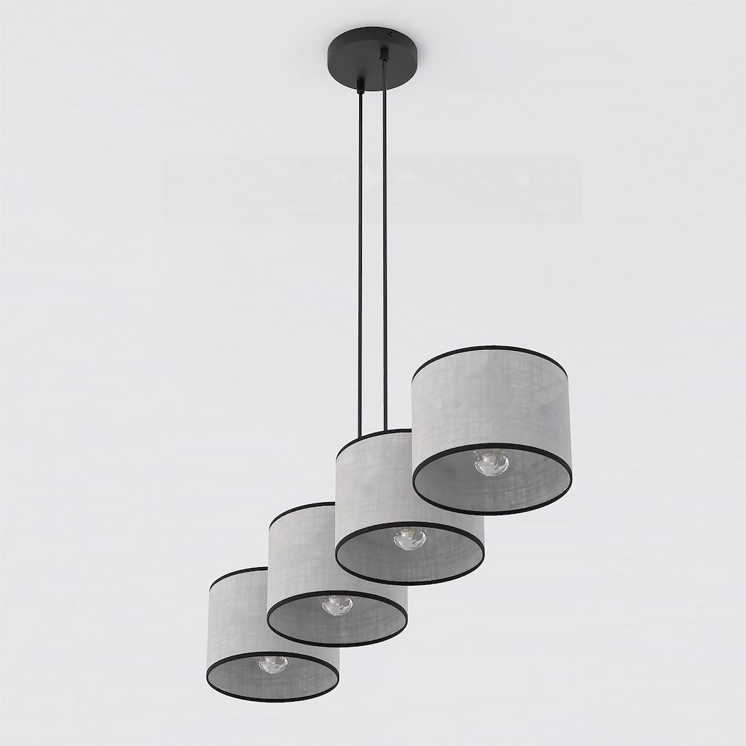 Vue rapprochée du bas montrant les quatre diffuseurs cylindriques et leurs ampoules allumées