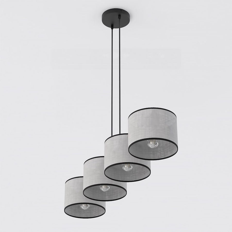 Vue rapprochée du bas montrant les quatre diffuseurs cylindriques et leurs ampoules allumées