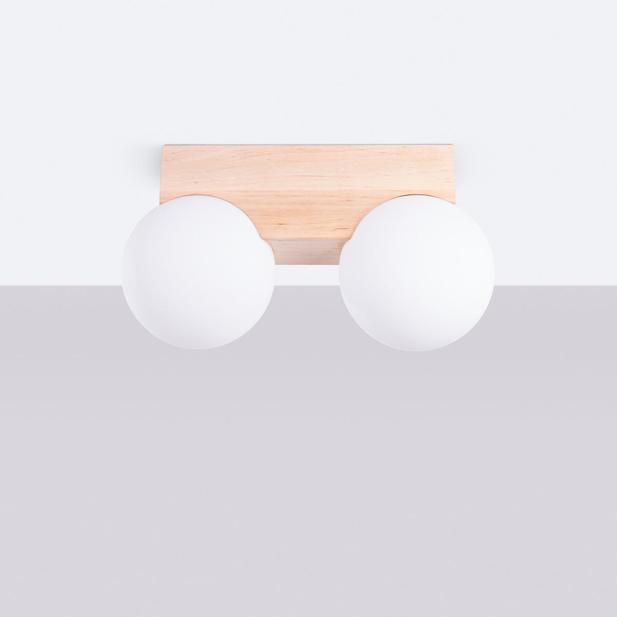 Vue de face montrant le socle rectangulaire en bois fixé au plafond.