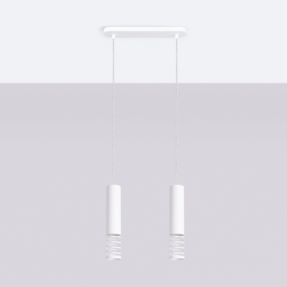 Mise en ambiance claire montrant la suspension blanche et ses ombres portées douces