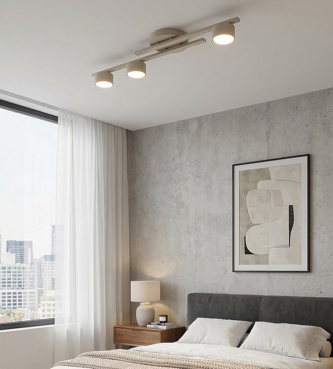 Mise en ambiance dans une chambre, plafonnier allumé au-dessus du lit gris