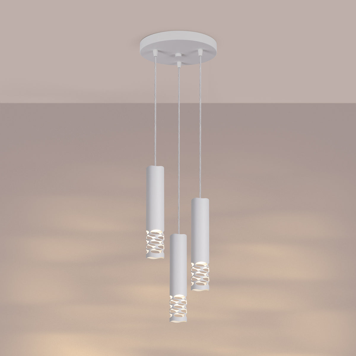 Mise en ambiance sur fond beige, la lumière chaude traverse les ouvertures des cylindres