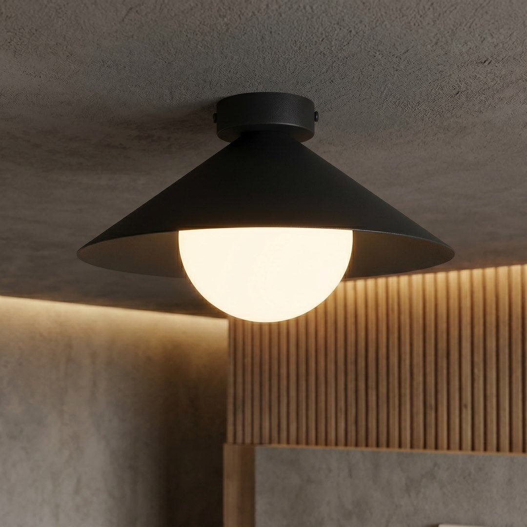 Détail rapproché de la finition noire mate et du verre opalin éclairé.