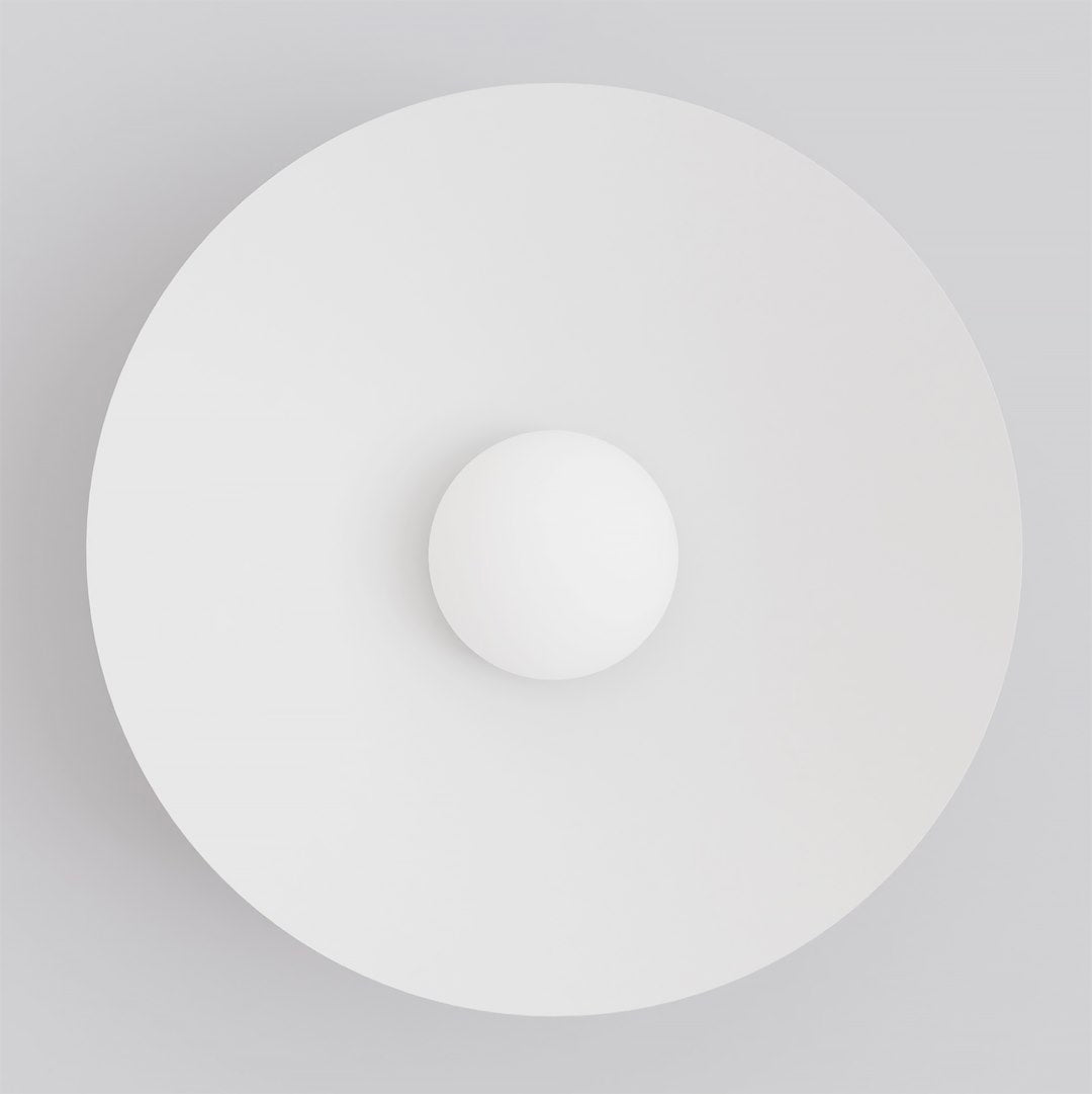 Face avant, grand disque blanc et petite sphère centrale éclairée