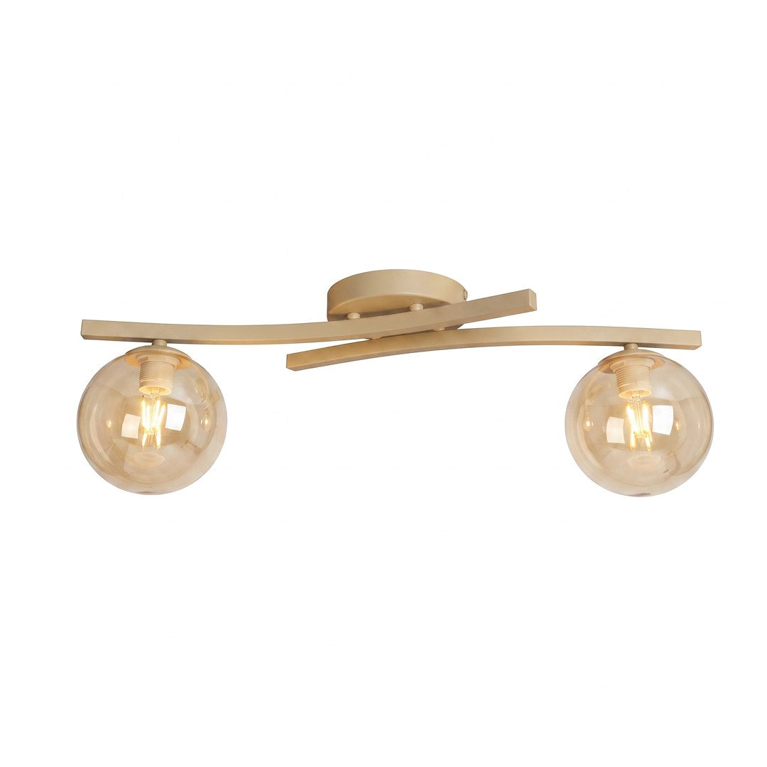 Second angle du luminaire, bras croisés en métal beige et diffuseurs sphériques allumés