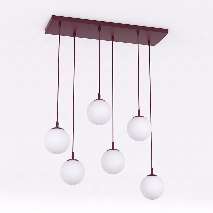 Luminaire présenté de face sur fond blanc, six globes suspendus à hauteurs variables.