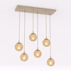 Suspension Cosmo 6 lumières beige, verre ambré