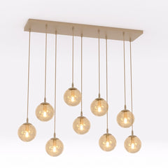 Suspension Cosmo 9 lumières beige, verre ambré
