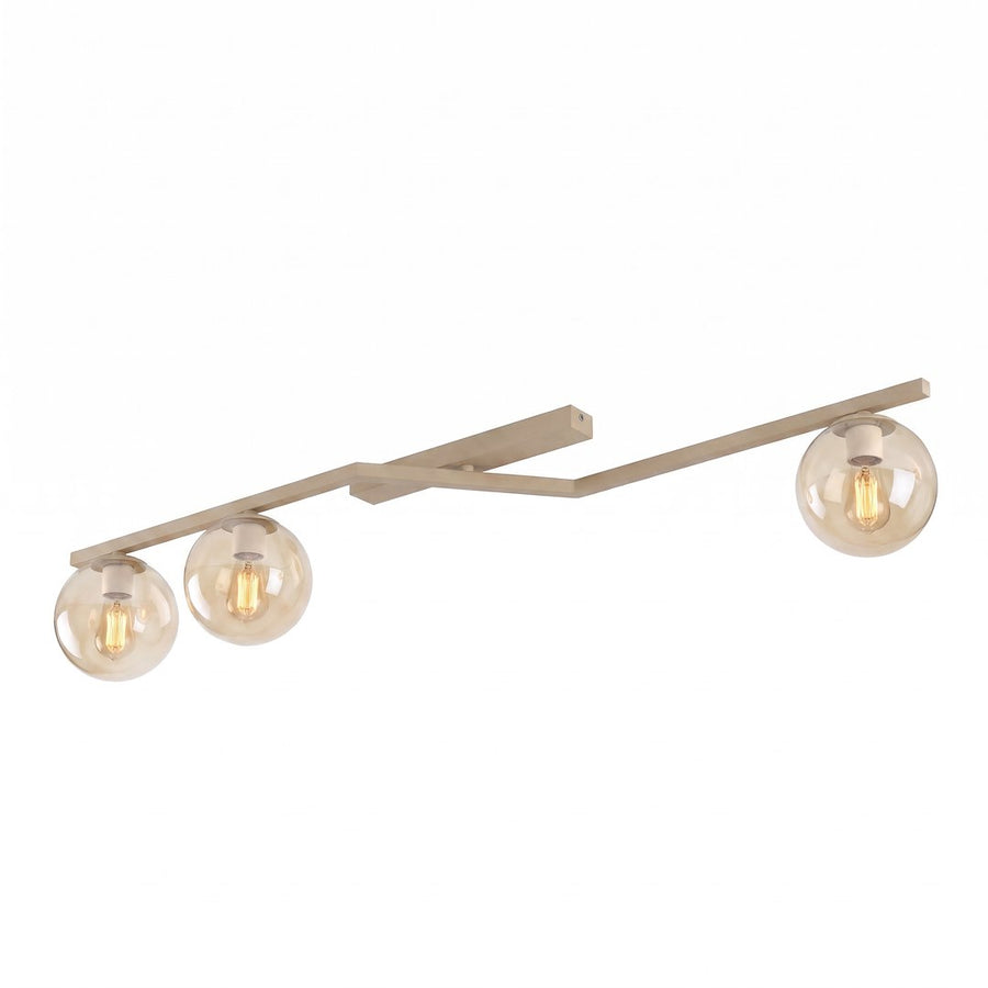 Luminaire beige à trois globes de verre ambré vu de face sur fond blanc