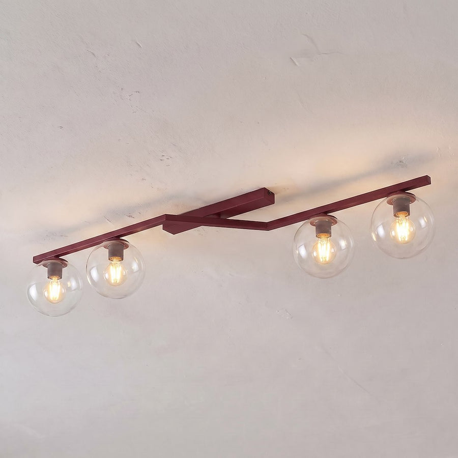 Luminaire fixé au plafond d'une pièce claire, ampoules allumées et halos lumineux