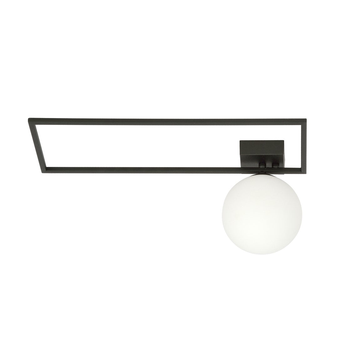 Vue de face du plafonnier allumé, verre opale diffusant une lumière chaude