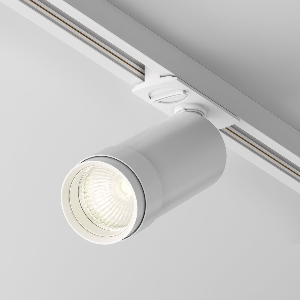 Spot blanc de profil montrant l'articulation et le rail plafond