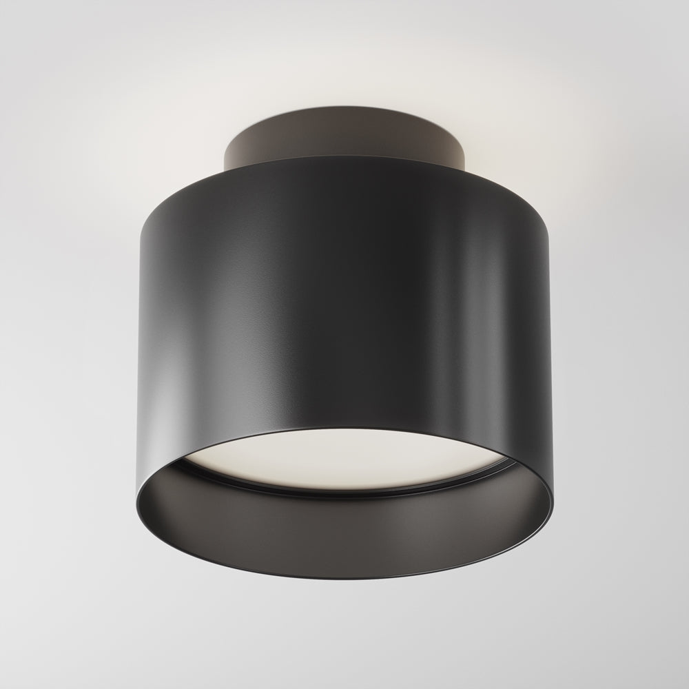 Version noire mate du plafonnier cylindrique, diffuseur blanc bien visible