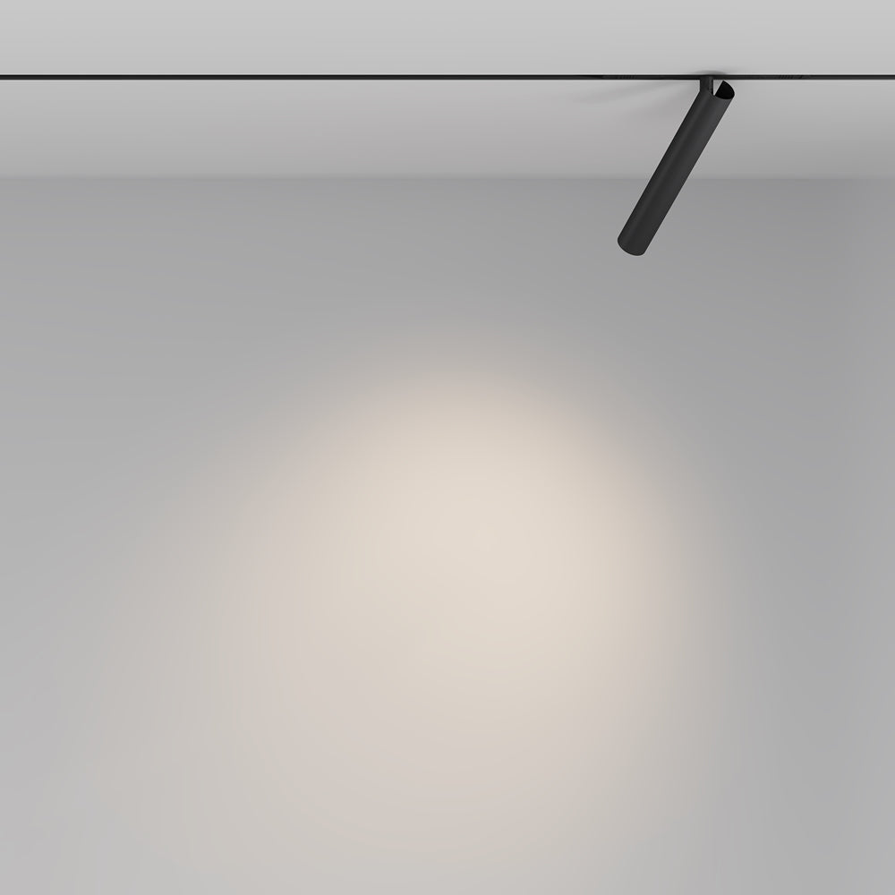 Mise en ambiance murale : le spot projette un halo lumineux doux sur le mur.