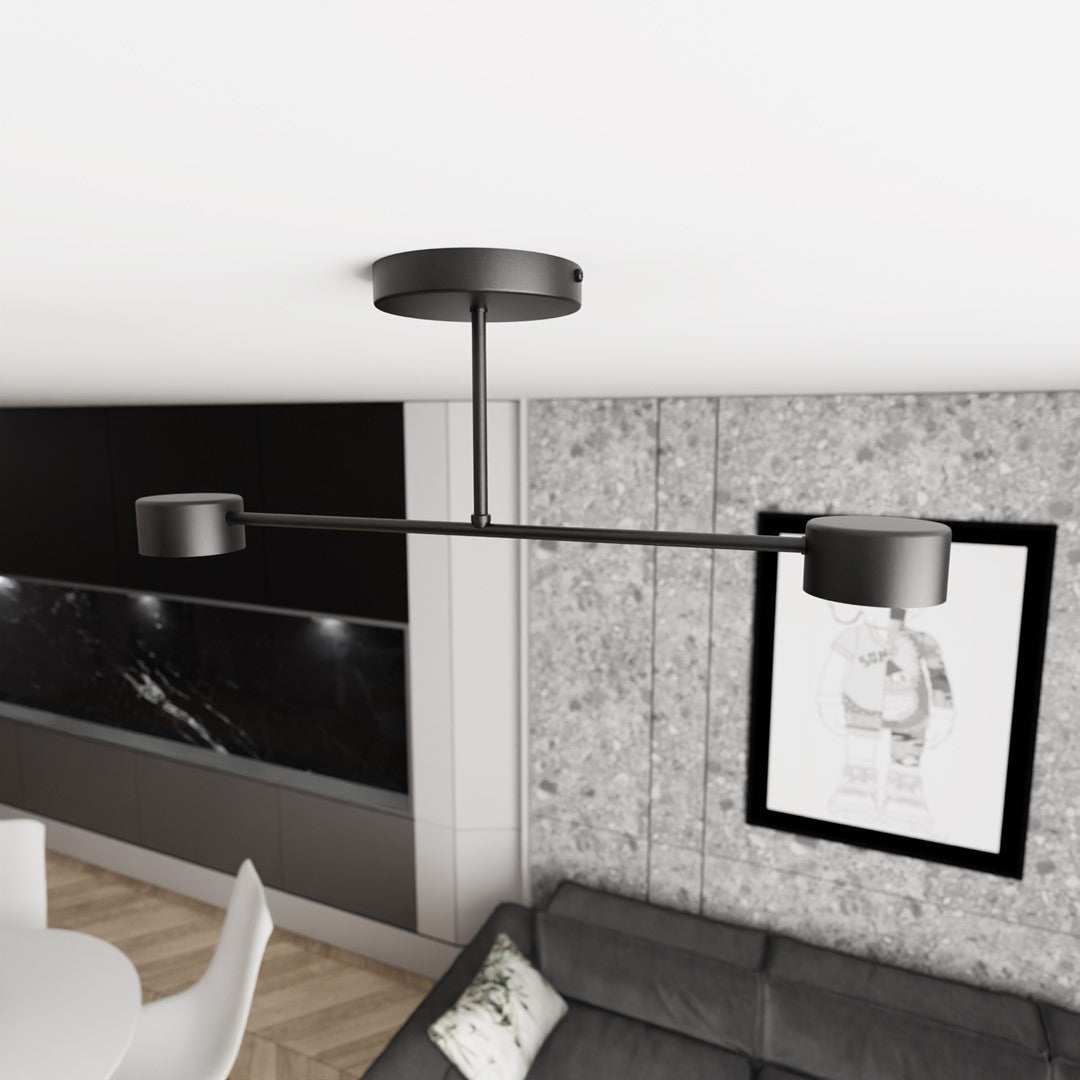 Vue en situation du plafonnier fixé au plafond d'un séjour moderne avec canapé et cadre.