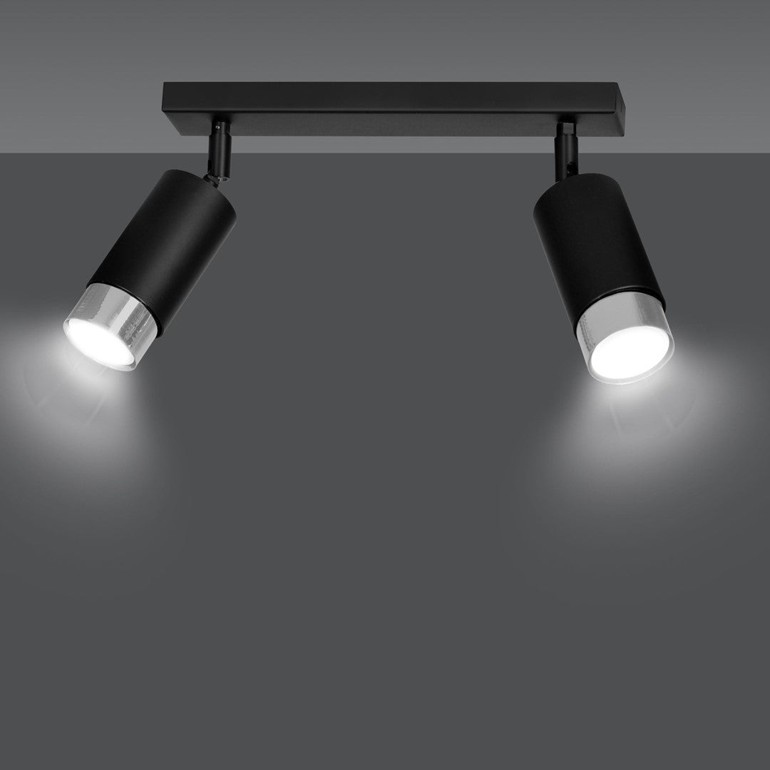 Spot double en fonctionnement sur fond gris, faisceaux lumineux orientables vers le bas.