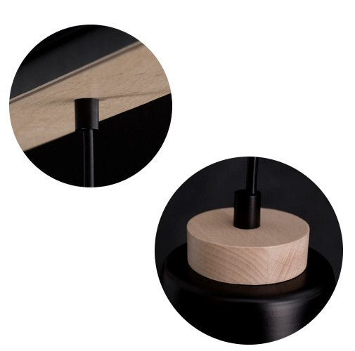 Détail du raccord en bois et de la fixation du câble sur le rail.