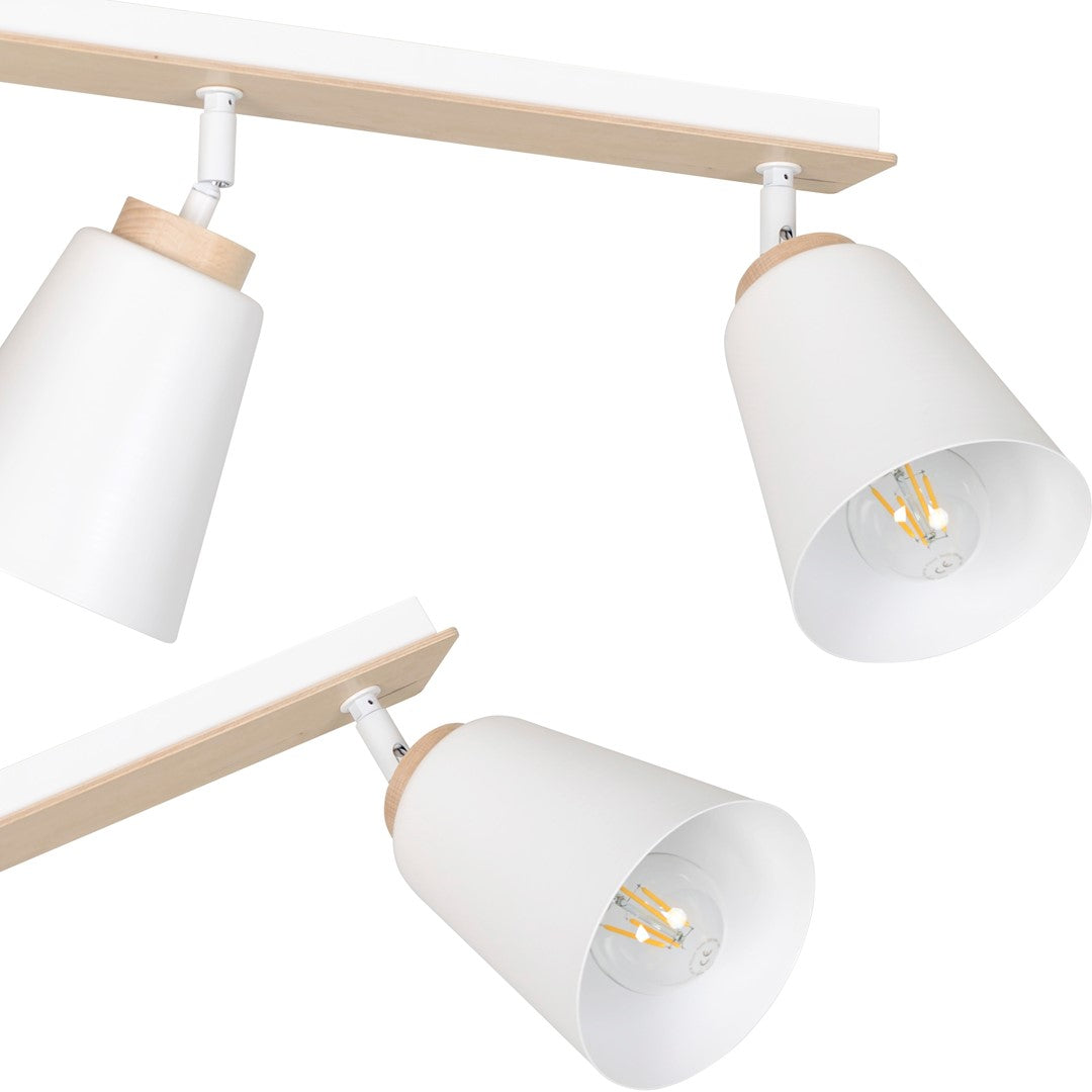 Gros plan sur les rotules orientables et l'intérieur des abat-jour avec ampoules visibles.