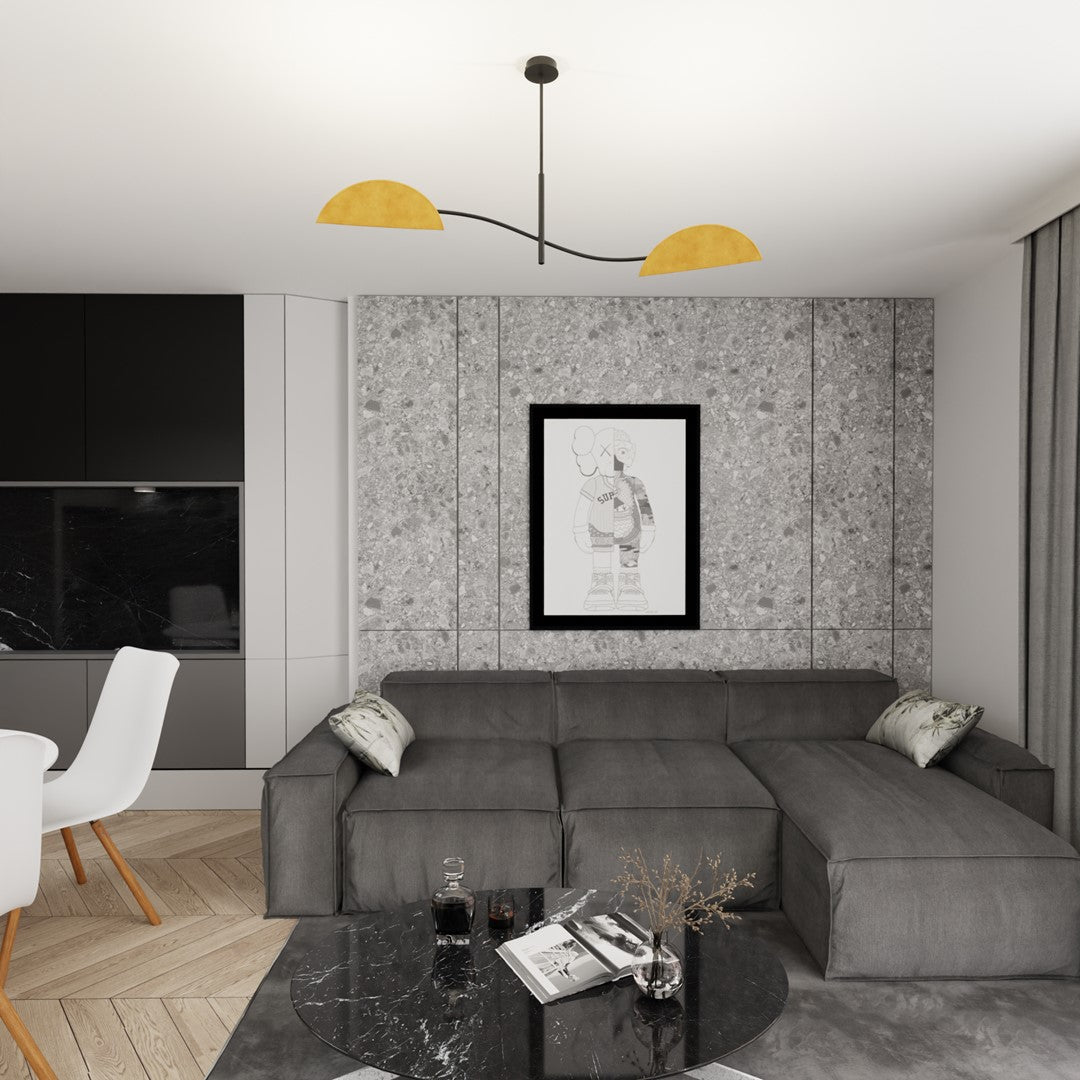 Luminaire installé dans un salon gris, au-dessus d'une table basse noire