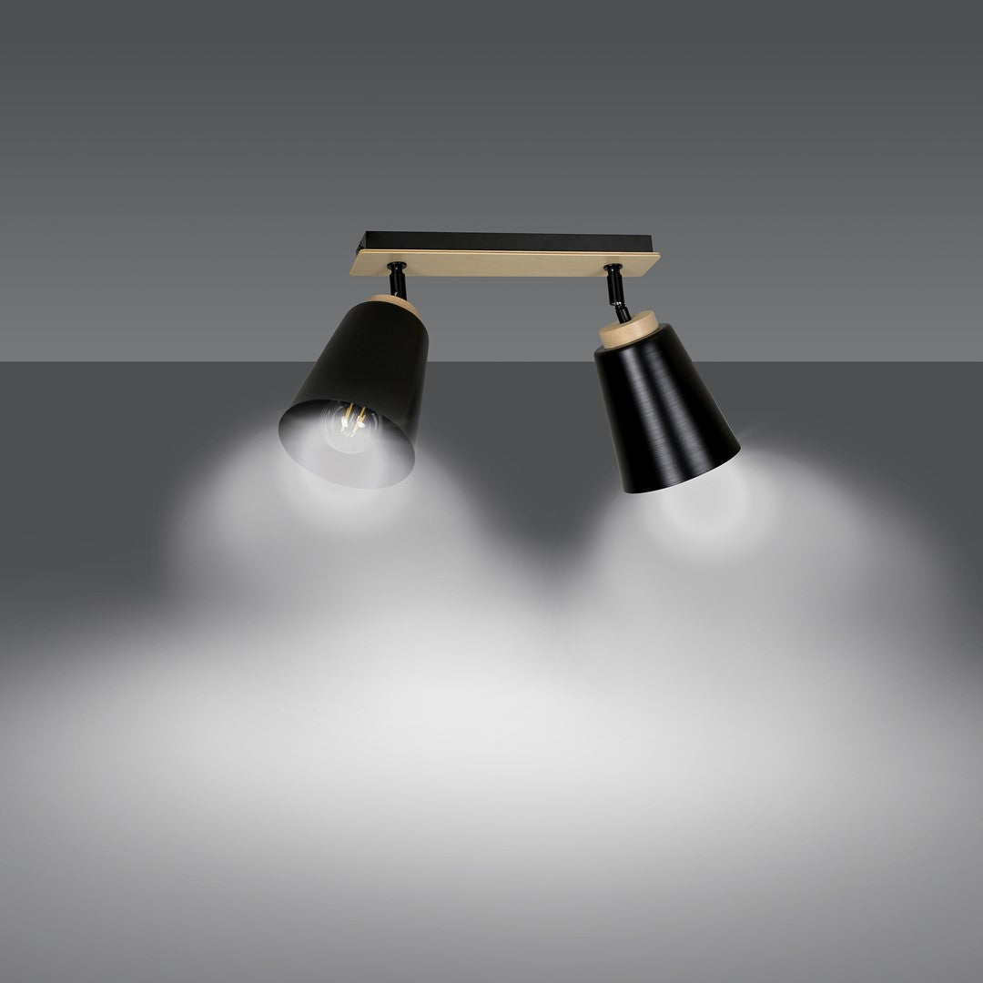 Mise en ambiance : deux faisceaux lumineux projetés sur un mur gris