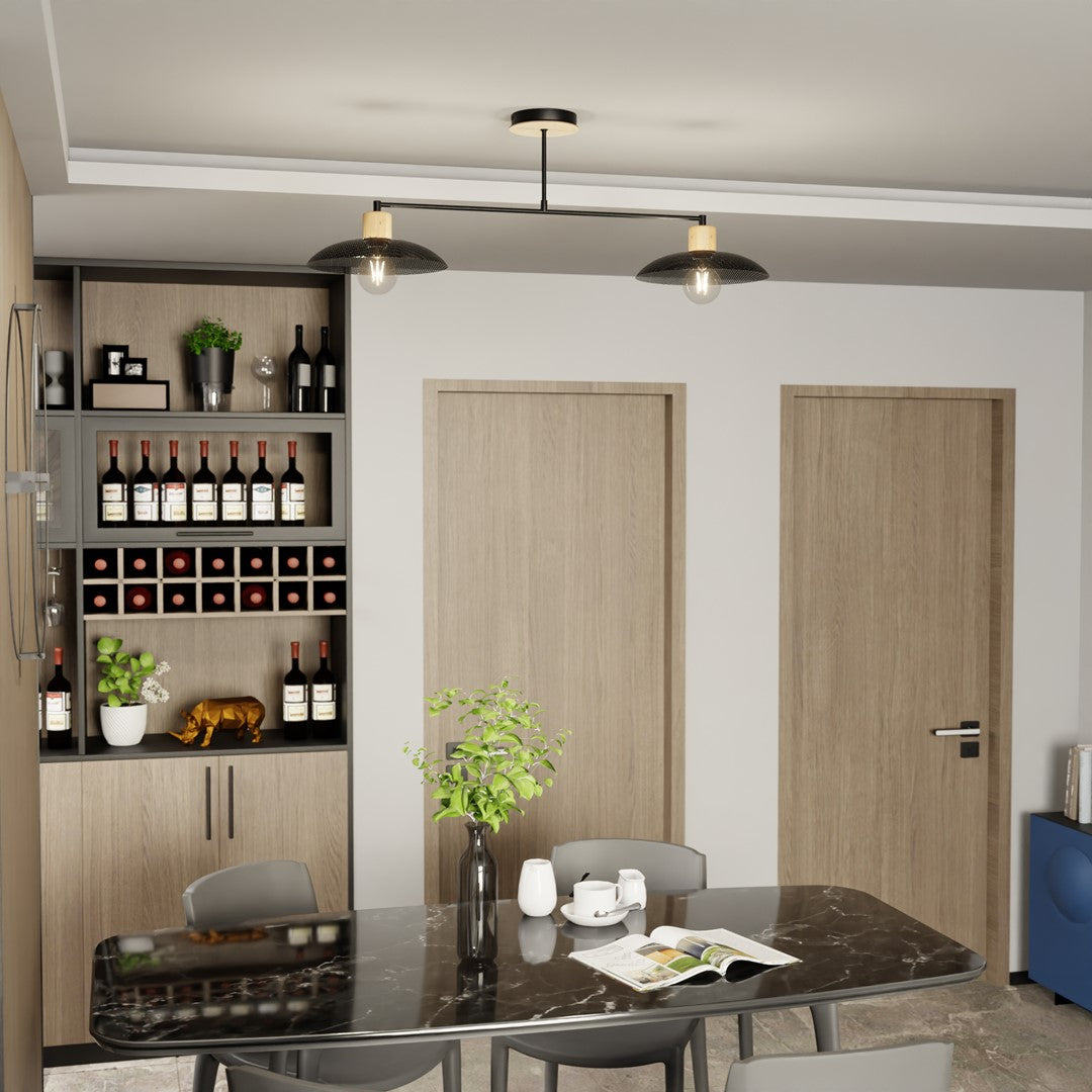 Vue large d'une salle à manger avec la suspension double allumée au-dessus de la table.
