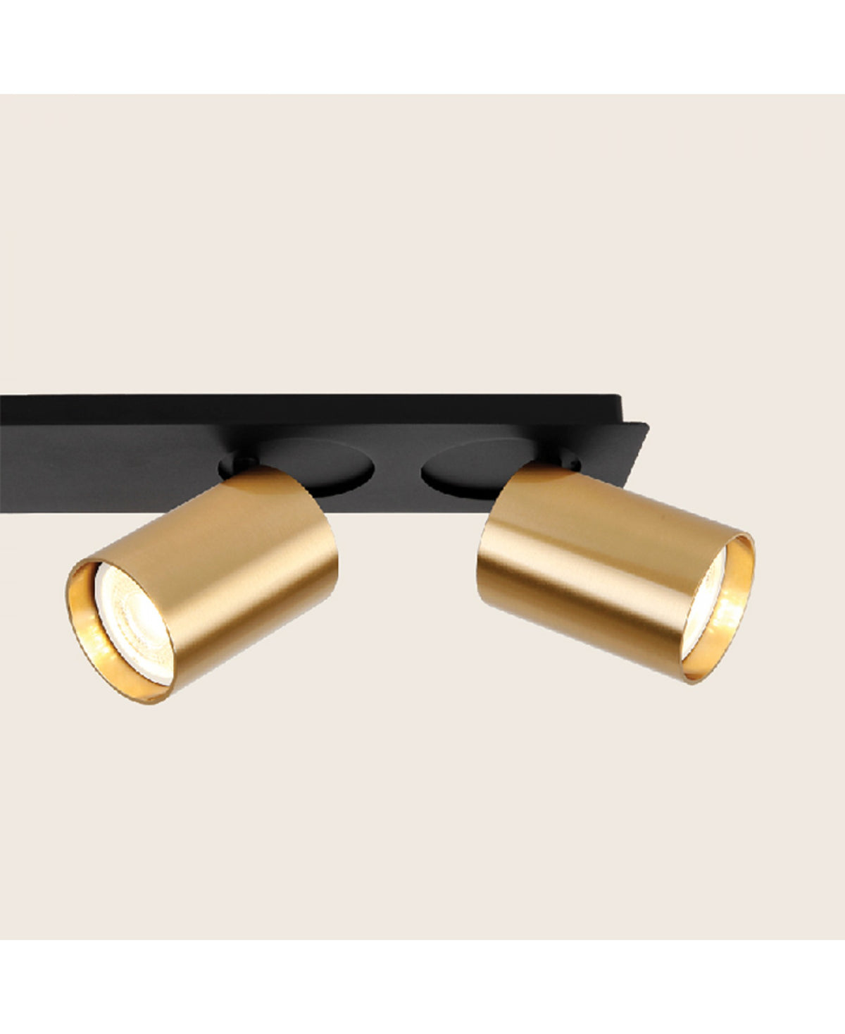 Deux spots orientables finition laiton brossé fixés sous une embase noire mate
