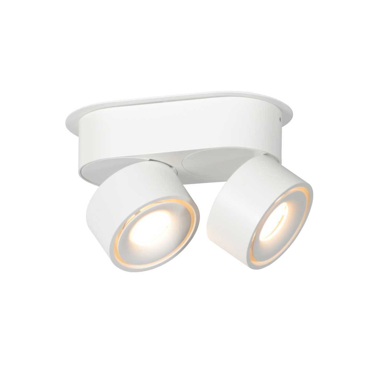 Vue en plongée des deux têtes inclinées, halo lumineux jaune autour des optiques