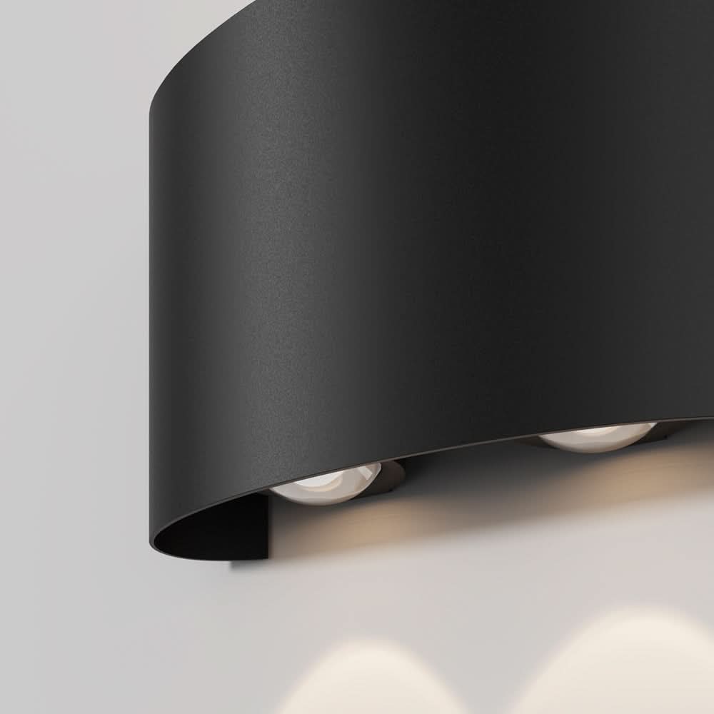 Vue rapprochée du bord courbe et des deux diffuseurs LED orientés vers le bas.