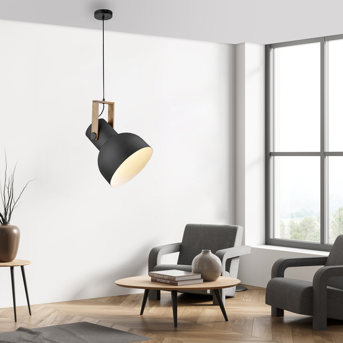 Mise en ambiance dans un salon clair, suspension allumée au-dessus d'un fauteuil.