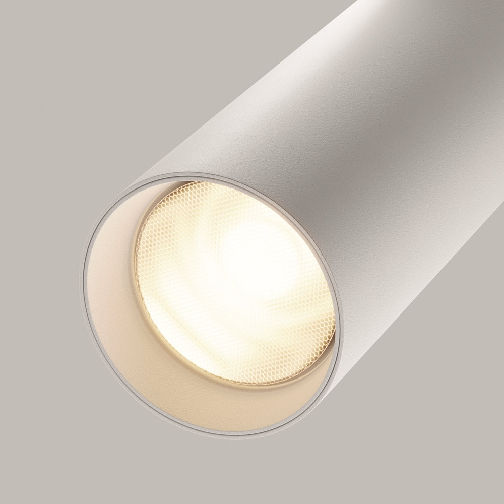 Détail de la sortie de lumière, réflecteur alvéolé doré et halo chaud