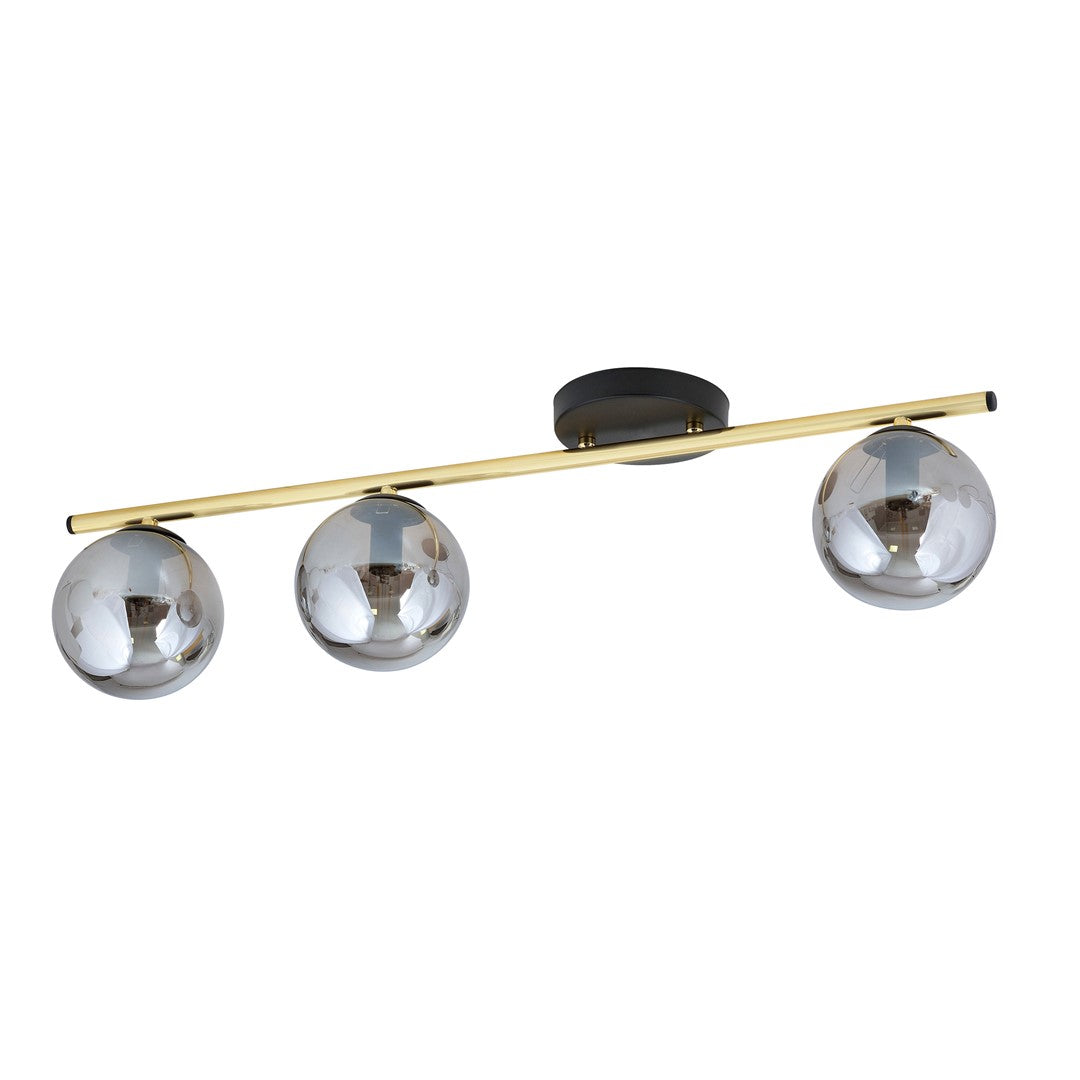 Vue rapprochée du luminaire, détails des globes graphite et finitions dorées