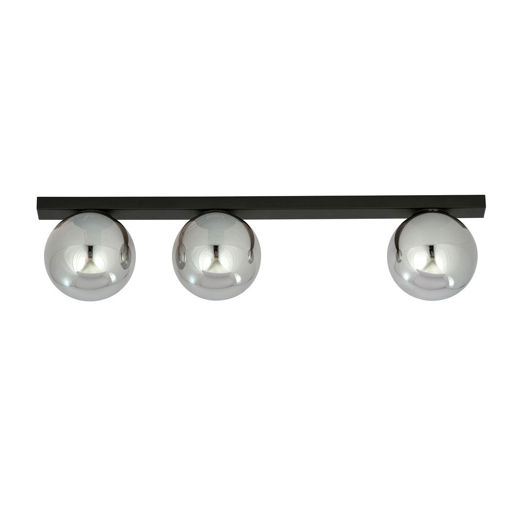 Vue de face du luminaire éteint, trois sphères en verre fumé réfléchissant la lumière