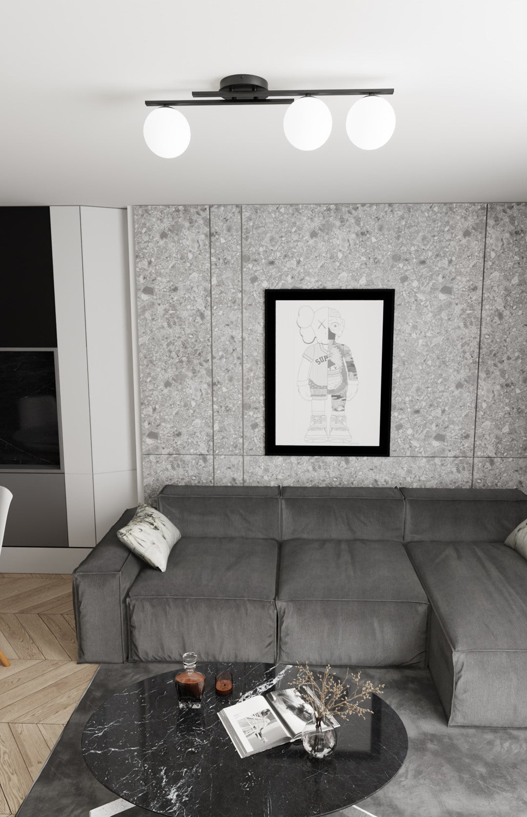 Mise en ambiance dans un salon gris avec mur en terrazzo et grande affiche encadrée