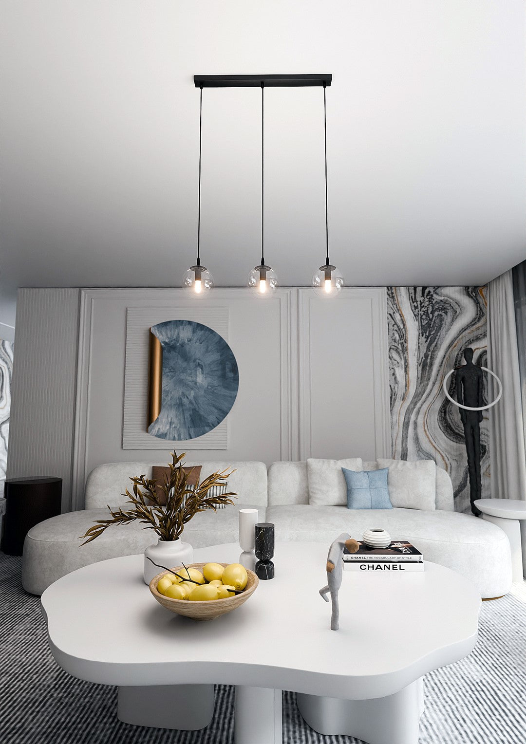 Mise en ambiance salon, la suspension éclaire au-dessus d'une table basse blanche