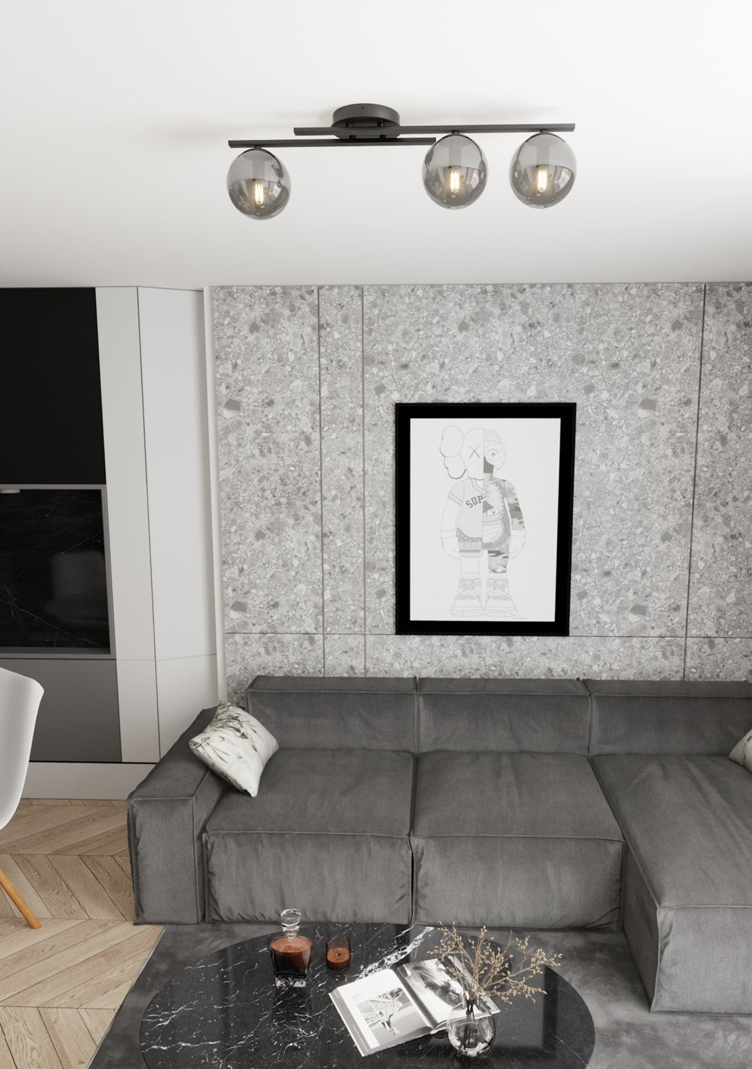 Mise en ambiance dans un salon avec canapé gris et mur en pierre